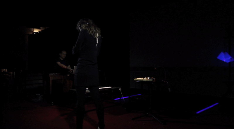A dancing female wearing sensors.